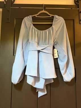 Arula size A Light Blue Peplum Long-Sleeve Women's Top